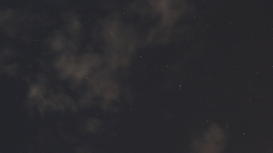 Dark Starry Night Sky with Faint Clouds and Scattered Stars HD wallpaper
