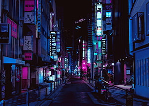 Neon-lit Tokyo alleyway at night with glowing signs and cyberpunk atmosphere HD wallpaper