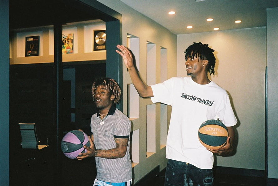 Playboi Carti and Lil Uzi Vert Holding Basketballs in Modern Interior HD wallpaper