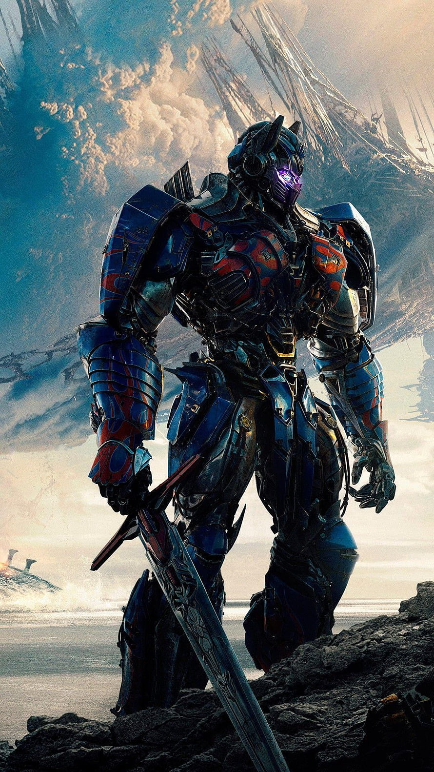 Optimus Prime in battle armor holding a sword on a rocky cliff with a dramatic sky HD phone wallpaper