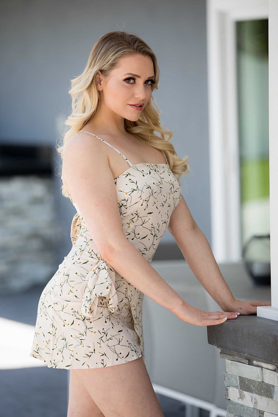 Mia Malkova in a Floral Romper on a Modern Balcony HD phone wallpaper