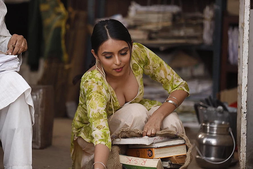 Kenisha Awasthi in Mastram: Woman Sorting Books in Rustic Indian Setting HD wallpaper