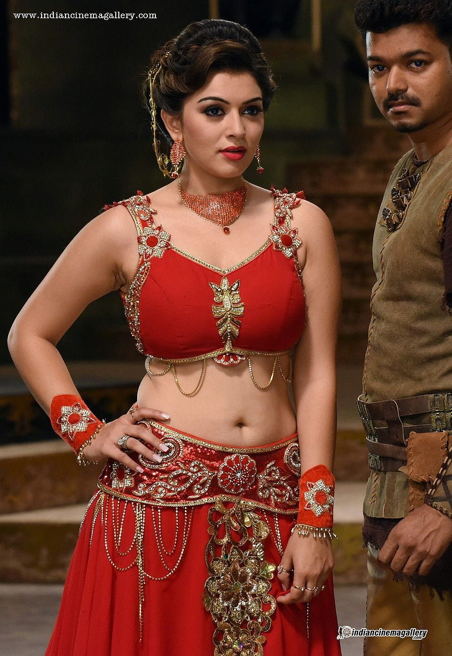 Hansika Motwani in ornate red traditional costume with gold jewelry and intricate embroidery HD phone wallpaper