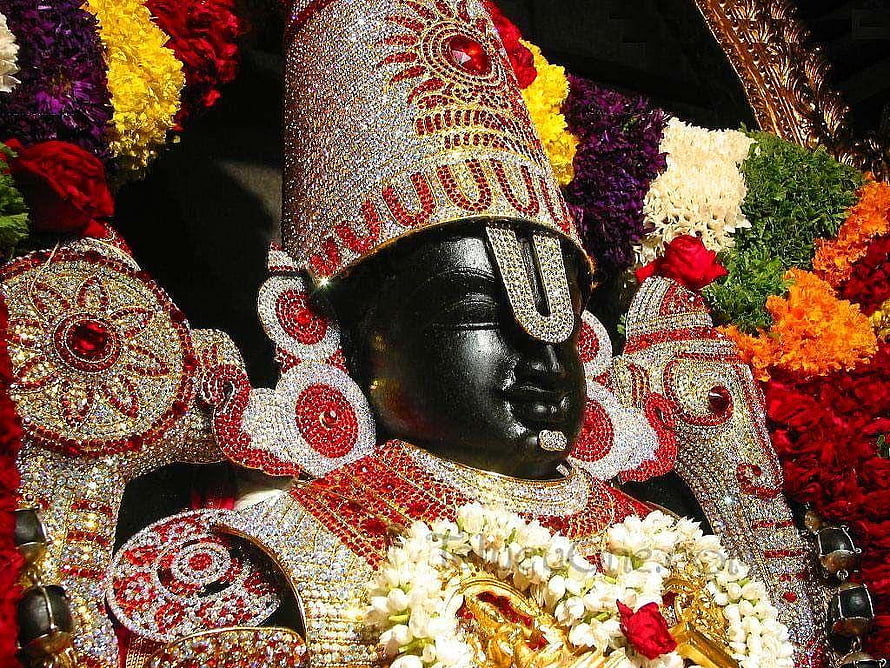 Perumal Temple Deity Adorned in Jewels and Marigold Garlands HD wallpaper