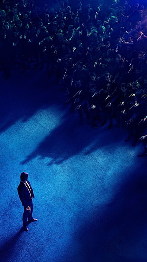 John Wick Standing Alone Facing a Crowd of Armed Men in Blue Tinted Cinematic Scene HD phone wallpaper