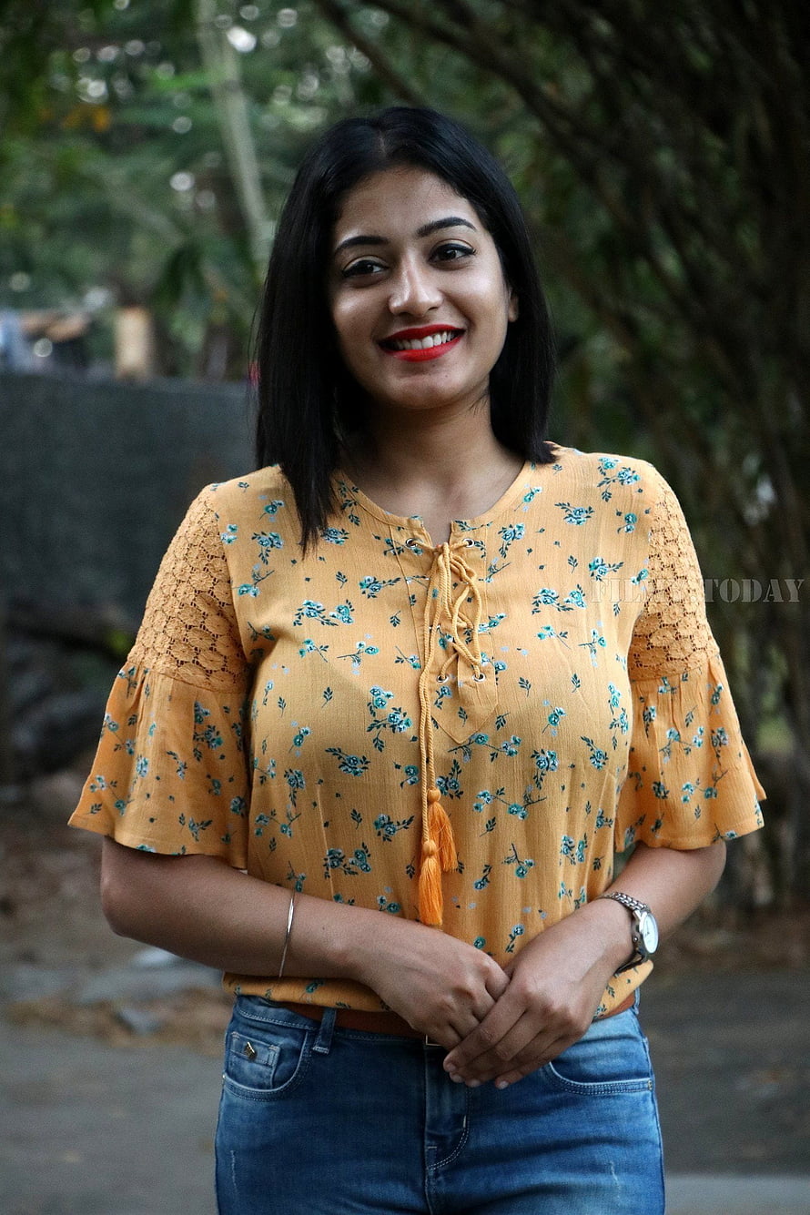 Anjali Nair in a Yellow Floral Top and Blue Jeans HD phone wallpaper