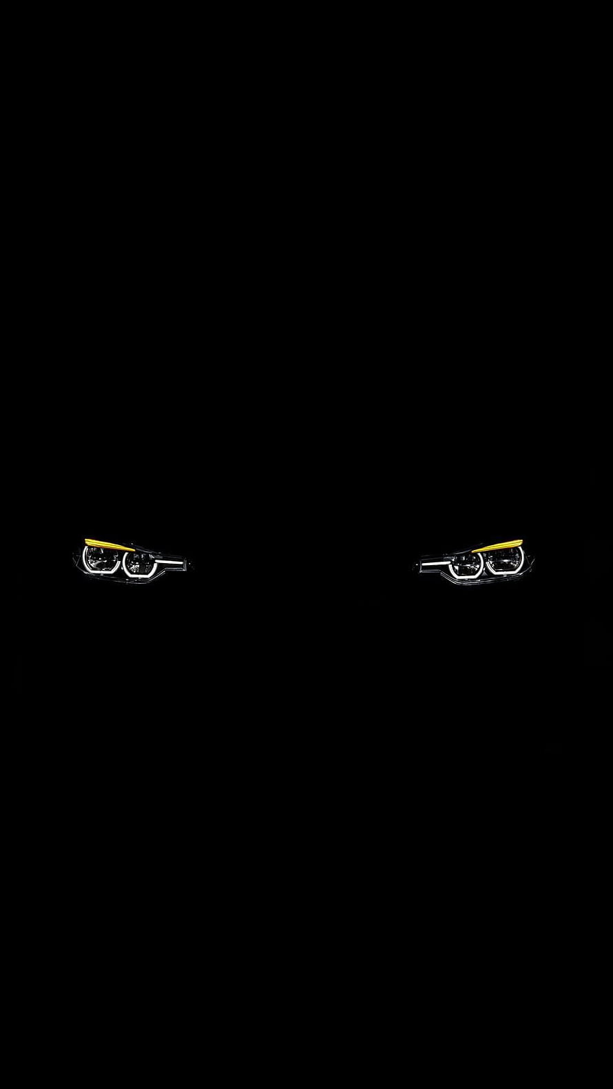 Minimalist Black AMOLED Headlight Wallpaper with Yellow Accents HD phone wallpaper