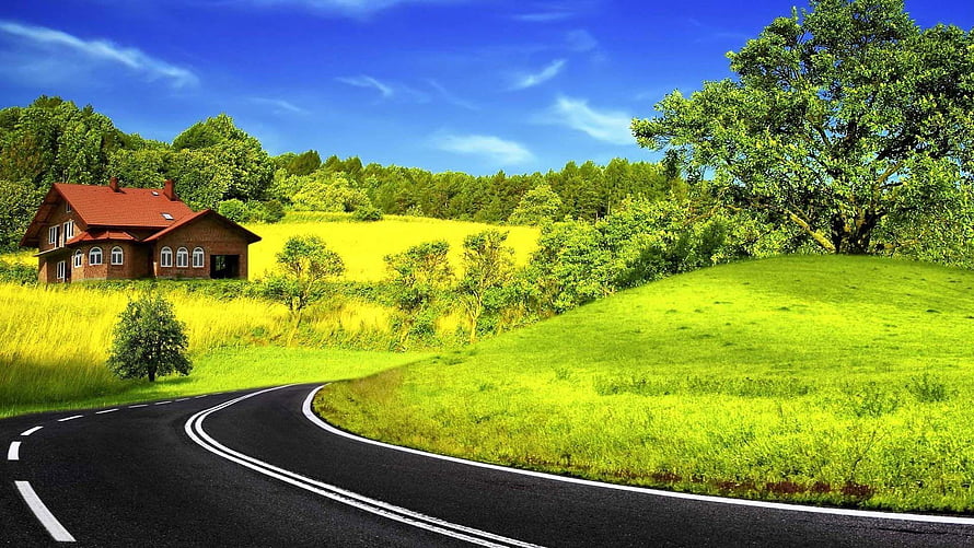 Winding Country Road Past a Red-Roofed Cottage in a Vibrant Green Landscape HD wallpaper