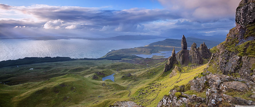 Old Man of Storr on Isle of Skye with dramatic coastal cliffs and green highlands HD wallpaper