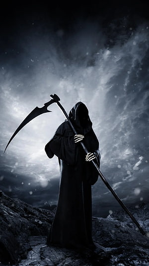 Grim Reaper Standing on Rocky Terrain Under a Dark Stormy Sky HD phone wallpaper