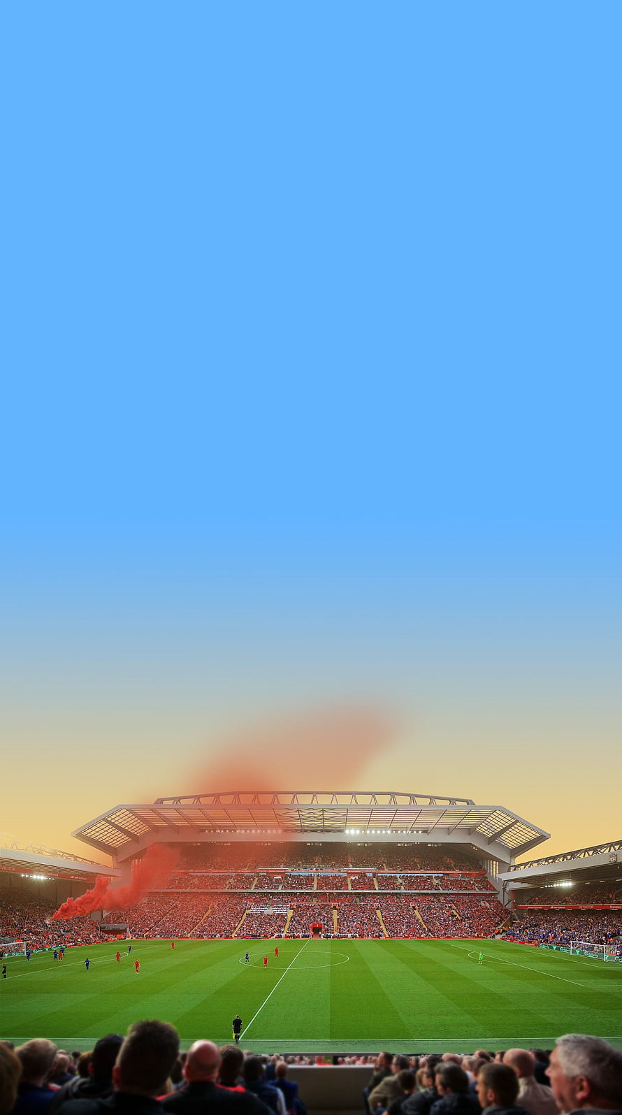 Anfield Stadium at Sunset with Red Flares and Full Football Pitch HD phone wallpaper