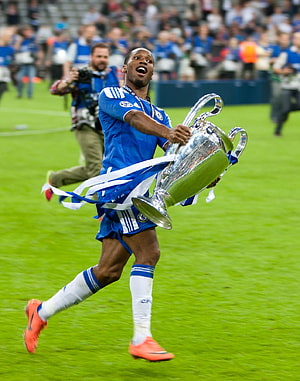 Didier Drogba Celebrating With The Champions League Trophy In Chelsea Kit HD phone wallpaper