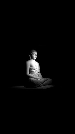 Serene Buddha Statue in Meditation Pose Against a Dark Background HD phone wallpaper