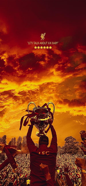Liverpool FC Player Lifting UEFA Champions League Trophy Against Dramatic Sunset Sky HD phone wallpaper