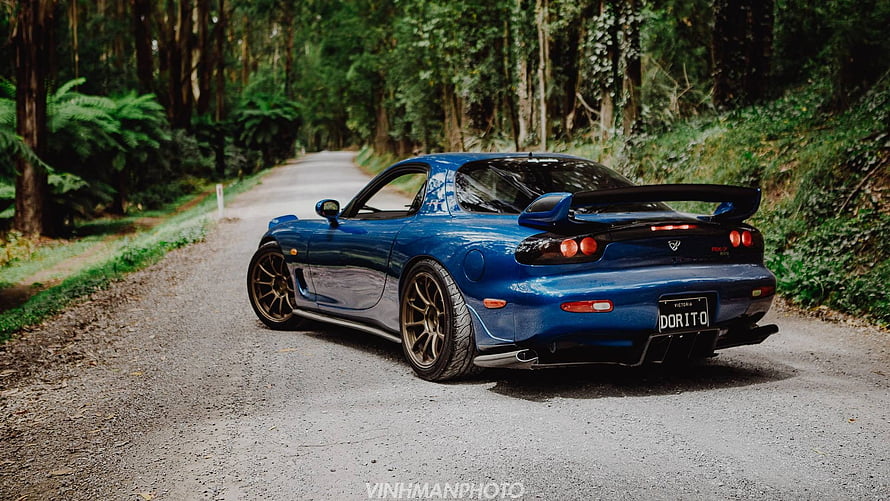 Blue Mazda RX-7 FD3S Rear View on a Forest Road with Custom Bronze Wheels HD wallpaper
