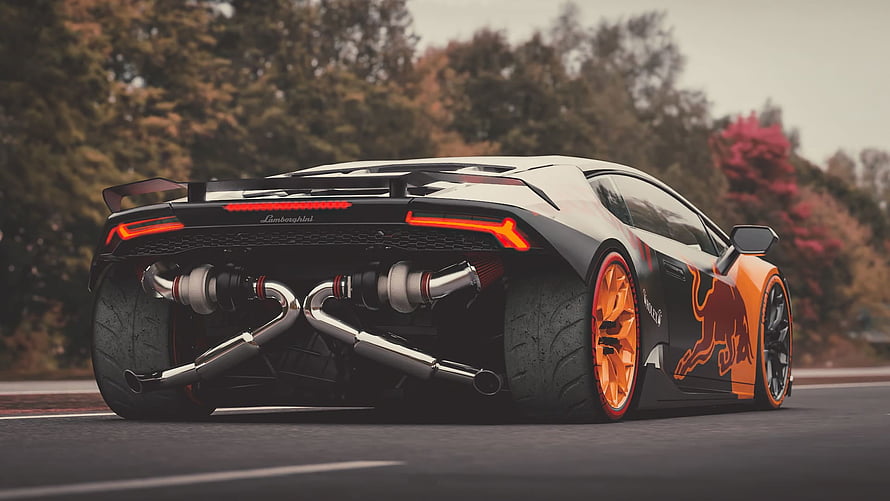 Lamborghini Huracan with Red Bull livery and exposed turbo exhaust on a racetrack HD wallpaper
