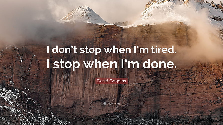 David Goggins Motivational Quote on Snow-Capped Mountain Cliffs HD wallpaper