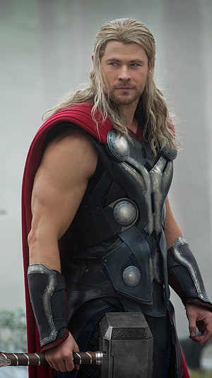 Thor in Asgardian Armor Holding Mjolnir with Red Cape and Long Blonde Hair HD phone wallpaper