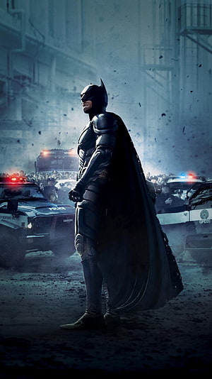 Batman in armored suit standing before police convoy in The Dark Knight Rises HD phone wallpaper