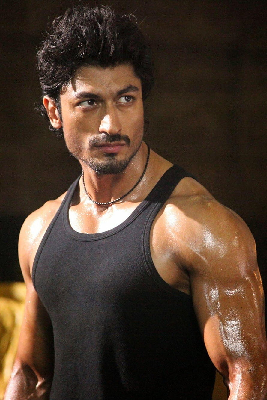 Vidyut Jammwal Muscular Portrait in Black Tank Top with Glistening Skin HD phone wallpaper