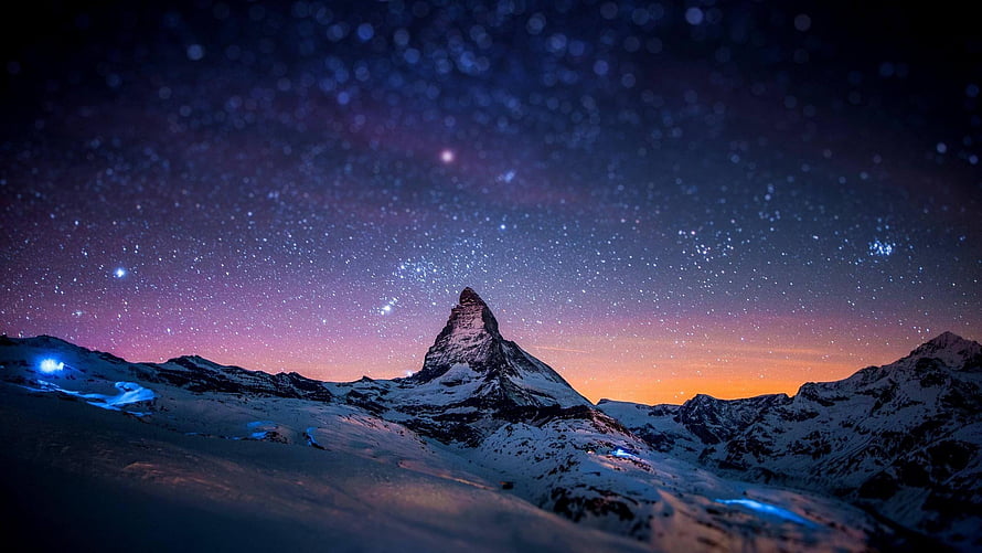 Matterhorn Peak Under a Starry Night Sky with Aurora and Snowy Alpine Landscape HD wallpaper