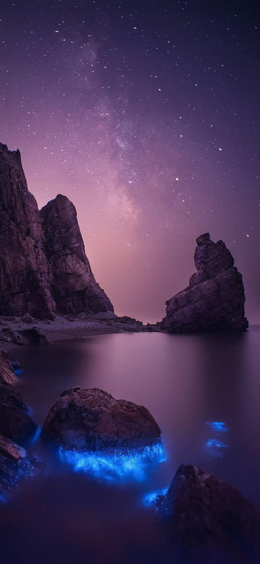 Bioluminescent Waves and Milky Way Over Coastal Rock Formations at Night HD phone wallpaper