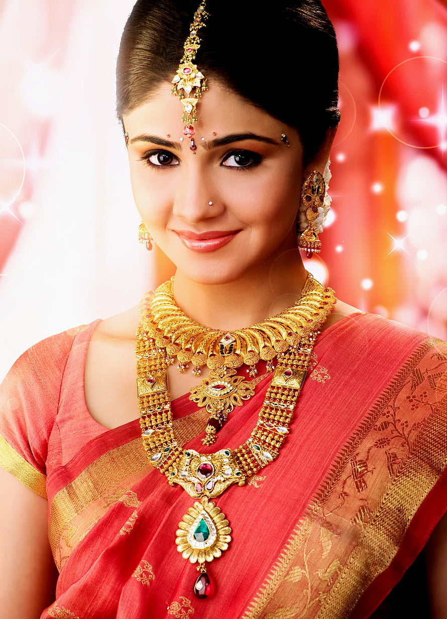 Elegant Indian Woman in Red Saree Wearing Traditional Gold Jewelry and Maang Tikka HD phone wallpaper