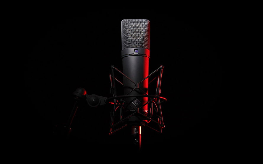 Professional Condenser Microphone in Shock Mount with Dramatic Red Lighting HD wallpaper