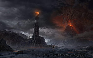 Barad-dur Tower and Eye of Sauron in a Dark Volcanic Landscape HD wallpaper