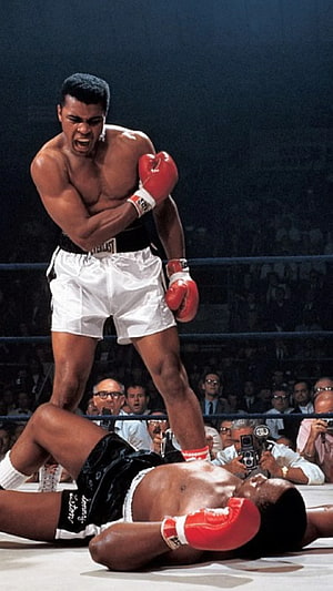 Muhammad Ali Standing Over Knocked Out Opponent in Classic Boxing Match HD phone wallpaper