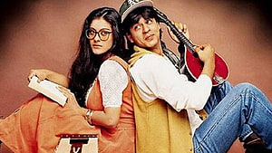 Shah Rukh Khan and Kajol in Dilwale Dulhania Le Jayenge promotional still with guitar and book HD wallpaper