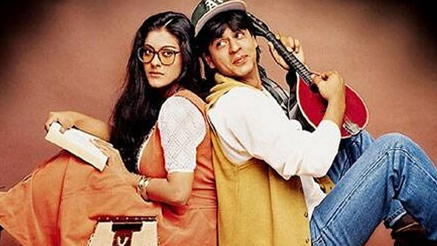 Shah Rukh Khan and Kajol in Dilwale Dulhania Le Jayenge promotional still with guitar and book HD wallpaper