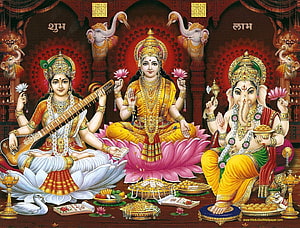 Lakshmi Ganesha Saraswati Triad on Lotus Thrones with Offerings and Temple Backdrop HD wallpaper
