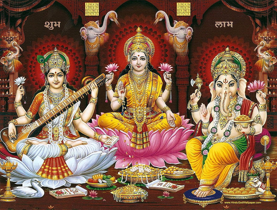 Lakshmi Ganesha Saraswati Triad on Lotus Thrones with Offerings and Temple Backdrop HD wallpaper
