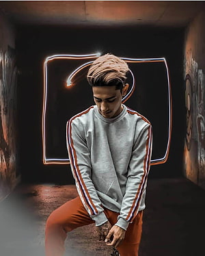 Danish Zehen in Grey Track Top and Orange Pants with Neon Light Background HD phone wallpaper