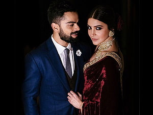 Virat Kohli and Anushka Sharma in formal attire at a celebratory event HD wallpaper