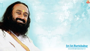 Sri Sri Ravi Shankar smiling portrait with white kurta and tilak on a soft blue background HD wallpaper