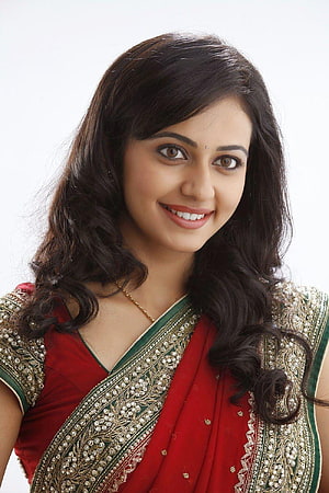 Rakul Preet Singh in a red and green embroidered sari with long wavy hair HD phone wallpaper