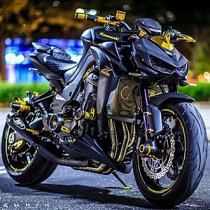 Kawasaki Z1000 Sport Bike with Gold Accents Parked on Street at Night HD phone wallpaper