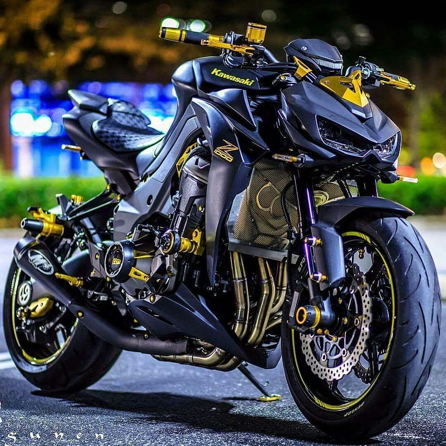 Kawasaki Z1000 Sport Bike with Gold Accents Parked on Street at Night HD phone wallpaper