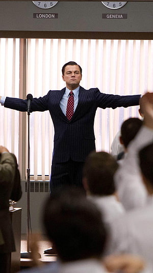 Leonardo DiCaprio in The Wolf of Wall Street standing with arms outstretched before a crowd HD phone wallpaper