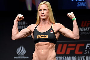 Holly Holm UFC Weigh-In Pose in Black Reebok Sports Bra HD wallpaper