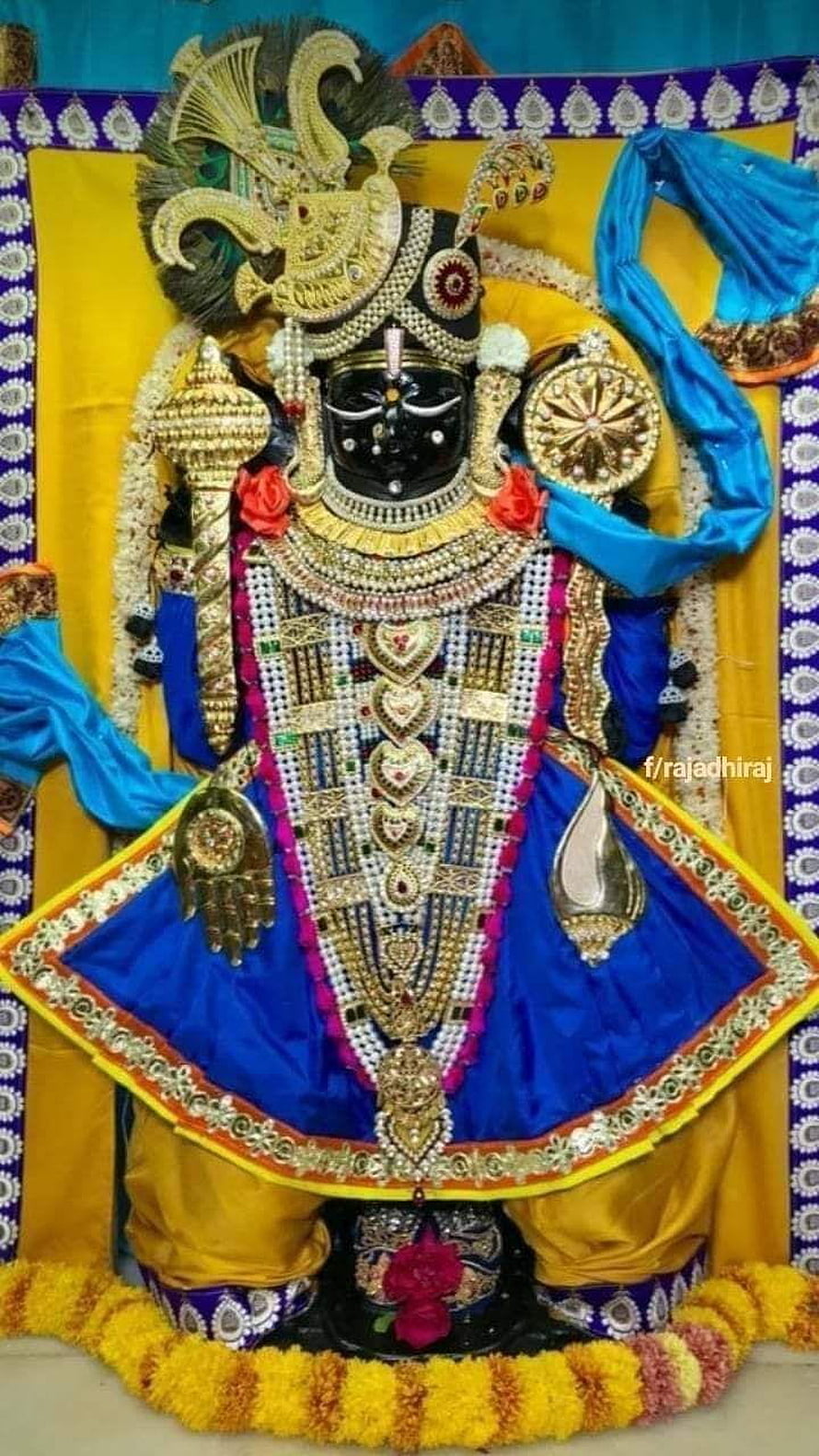 Ornate Dwarkadhish Murti Adorned in Royal Blue Attire and Gold Jewelry HD phone wallpaper