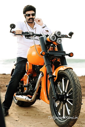 Nandamuri Balakrishna on Custom Orange Cafe Racer Motorcycle at Beach HD phone wallpaper