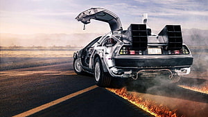 DeLorean Time Machine Burning Rubber on Desert Road at Sunset HD wallpaper