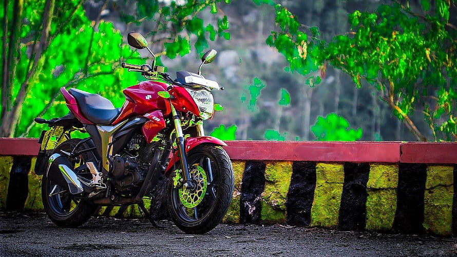 Red Honda CB Hornet 160R Motorcycle Parked Against Mossy Stone Wall in Lush Green Forest HD wallpaper