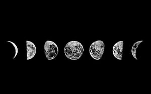 Monochrome Lunar Cycle: Seven Moon Phases Arranged in a Horizontal Row Against a Black Sky HD wallpaper