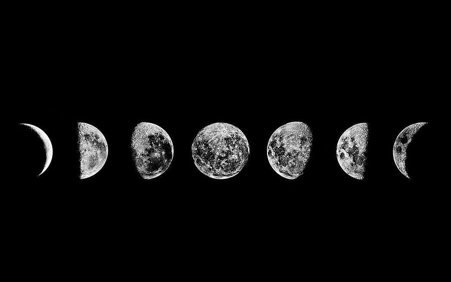 Monochrome Lunar Cycle: Seven Moon Phases Arranged in a Horizontal Row Against a Black Sky HD wallpaper
