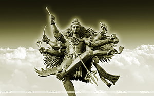 Kaal Bhairav Shiva Statue with Multiple Arms and Trishula Against Cloudy Sky HD wallpaper