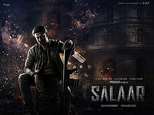Prabhas as Salaar in Dark Action Movie Poster with Shotgun and Fire HD wallpaper